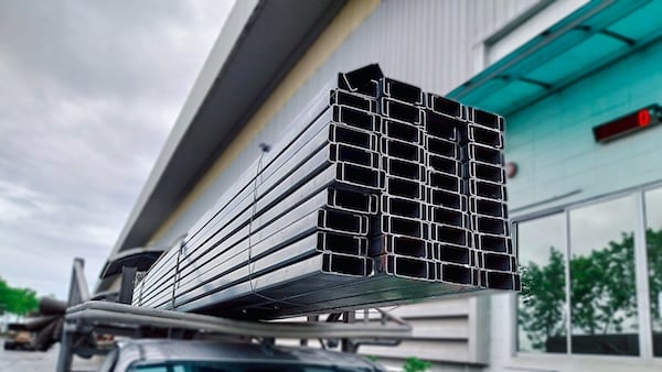 Stacked metal purlins illustrating purlin sizes