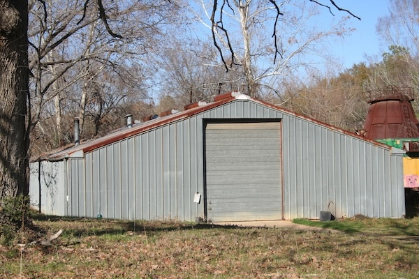 Small Metal pole barn in a field